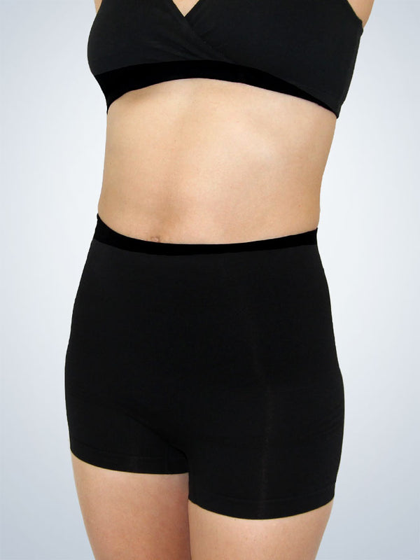 Front view of in postpartum shapewear boyshort with firm tummy control jet black