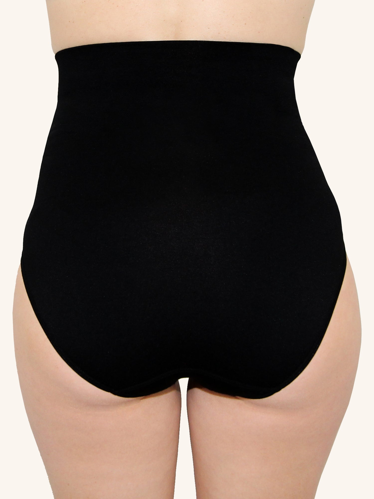 Back view of postpartum shapewear brief in jet black