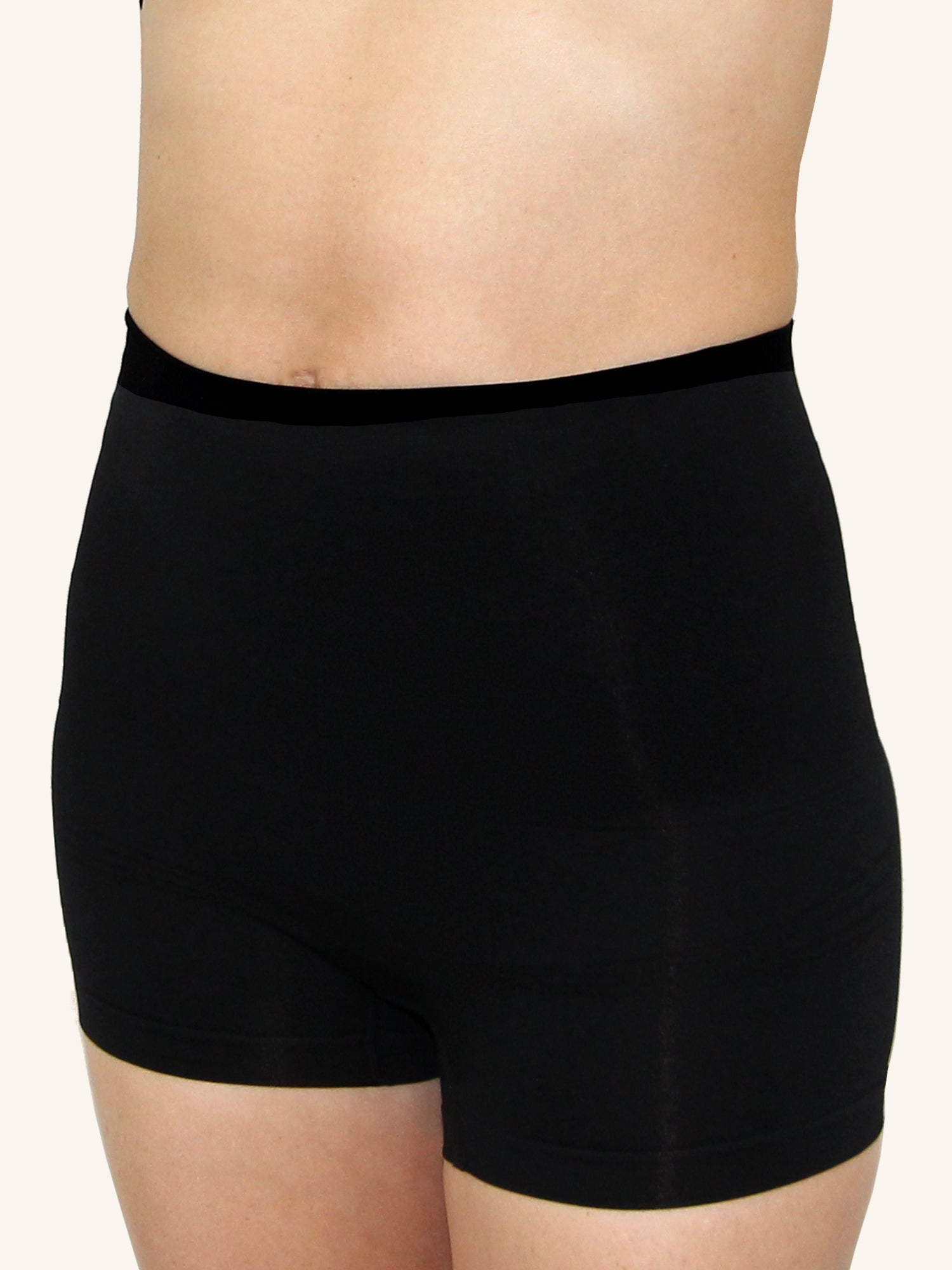 Front view of in postpartum shapewear boyshort with firm tummy control jet black