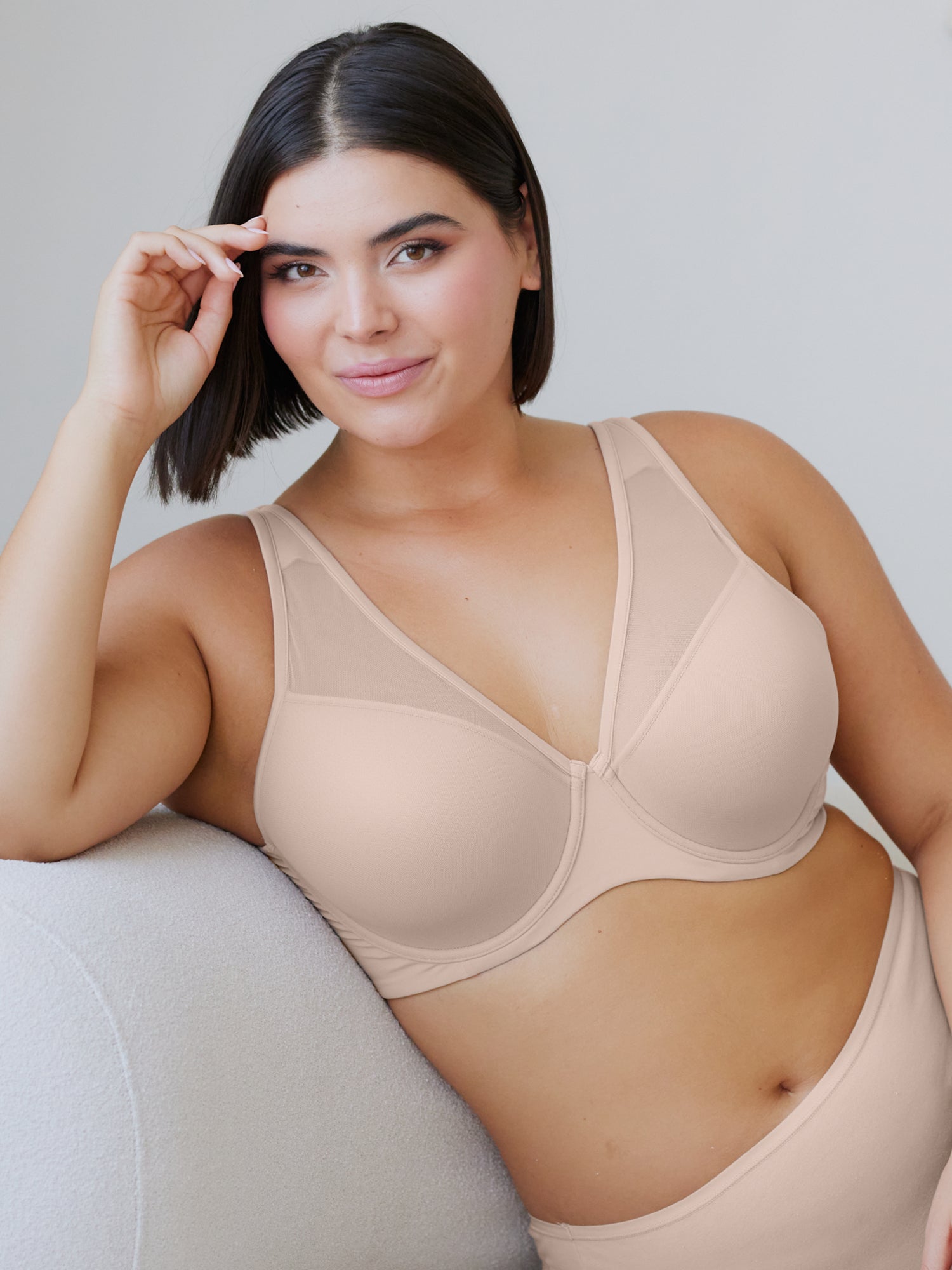 Lifestyle view of mesh plunge underwire bra in sand