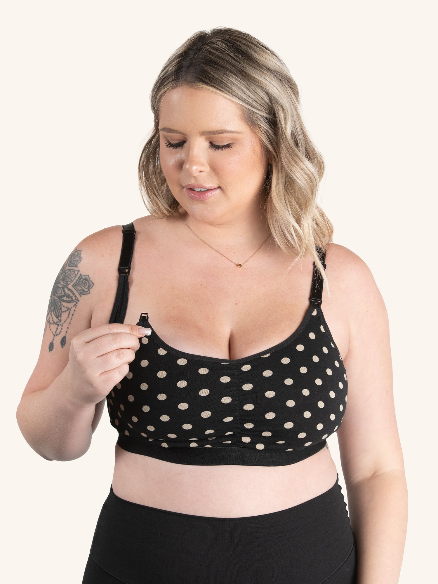 Front view of front comfort nursing bra in black with tan dot