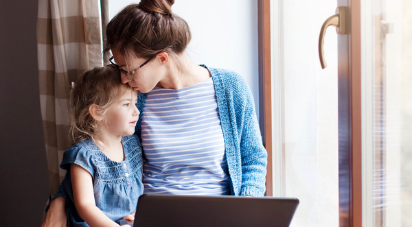 Woman sitting with toddler child