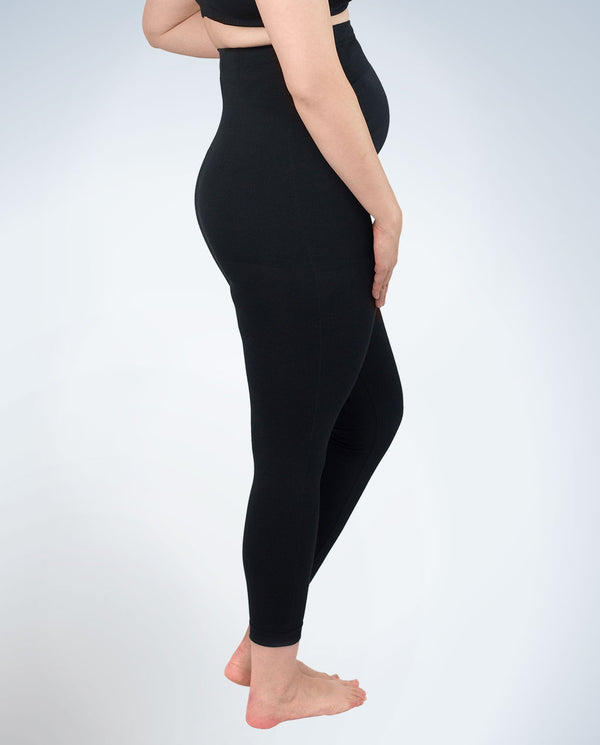 Side view of maternity jeggings in jet black