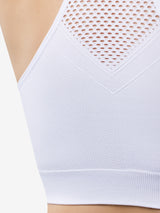 Close up detail view of cooling racerback sports bra in white