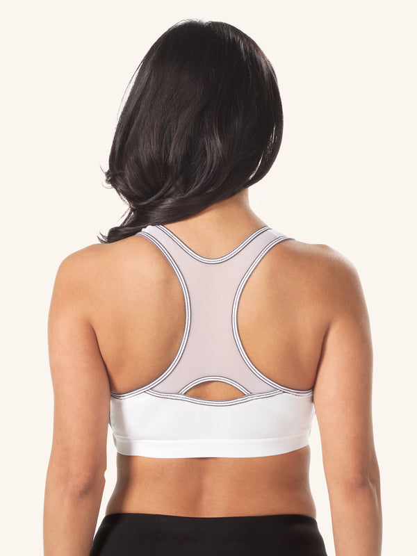 Side view of maternity to nursing adjustable sports bra in white