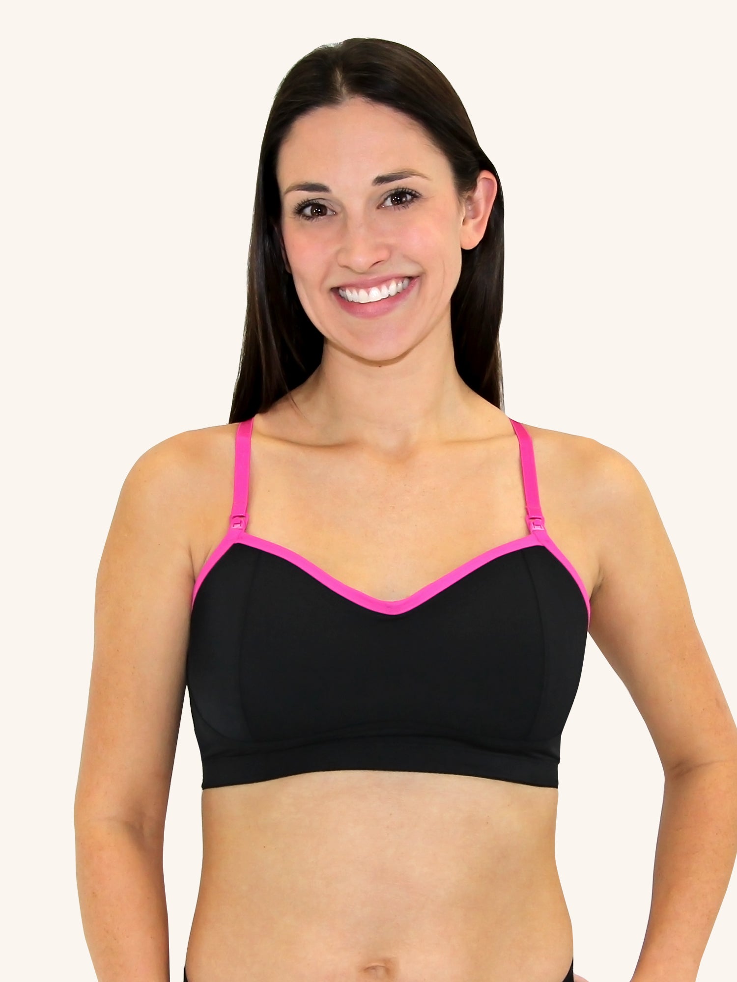 Front view of loving moments nursing sports bra in jet black with hot pink trim