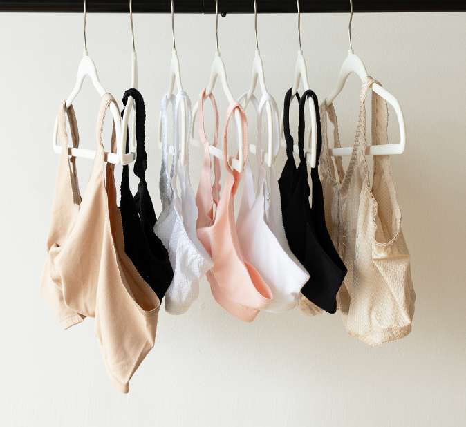 front-closure bras hanging on hangers