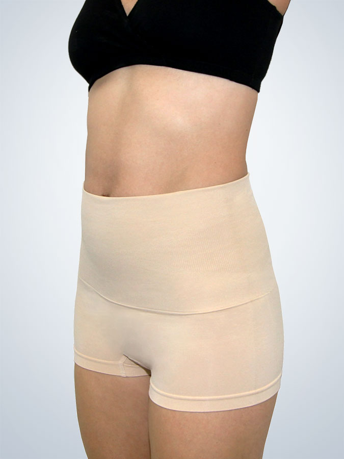 Front view of in postpartum shapewear boyshort with firm tummy control naturally nude