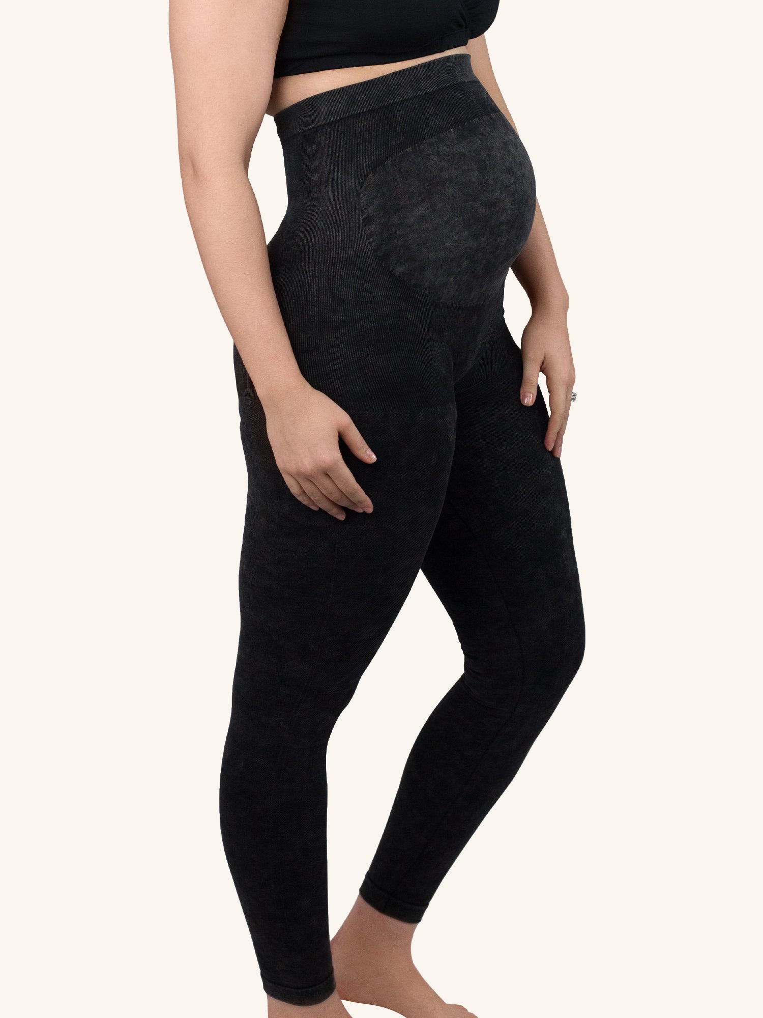 Side view of maternity jeggings in grey denim wash