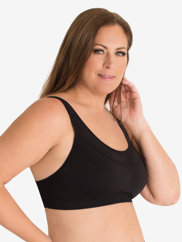 Side view of seamless medium impact sports bra in jet black